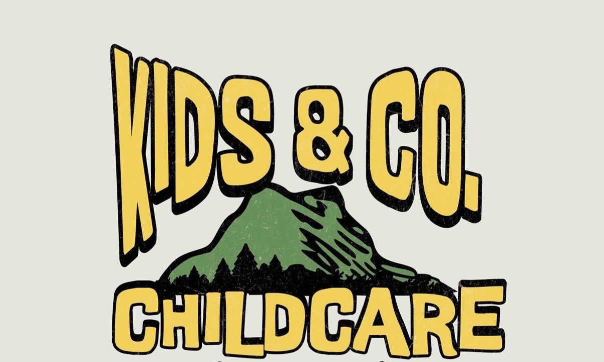 Kids & Co. Childcare, with a green mountain and pine trees beneath yellow lettering