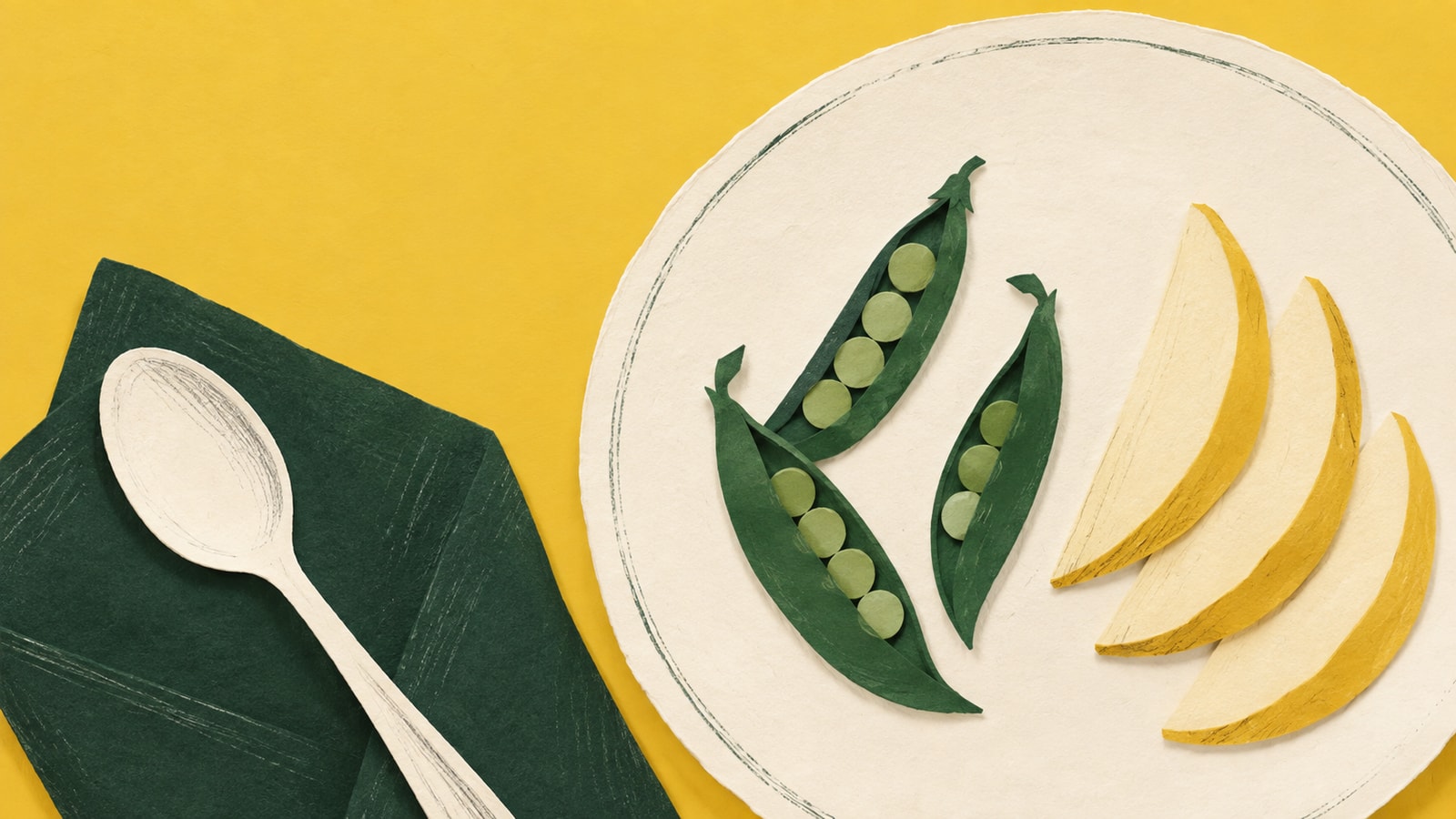 Cut-paper illustration of a cream plate with pea pods and pear slices beside a green napkin and spoon.